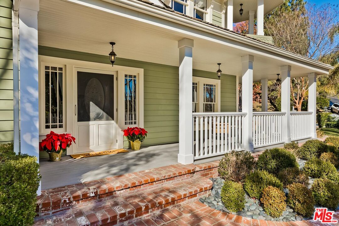 3827 Castle View Road Agoura Hills, CA 91301 - Photo 8 of 74 a view of a house with a flower plants