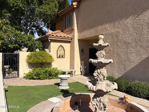a bathroom with a toilet sink and garden view
