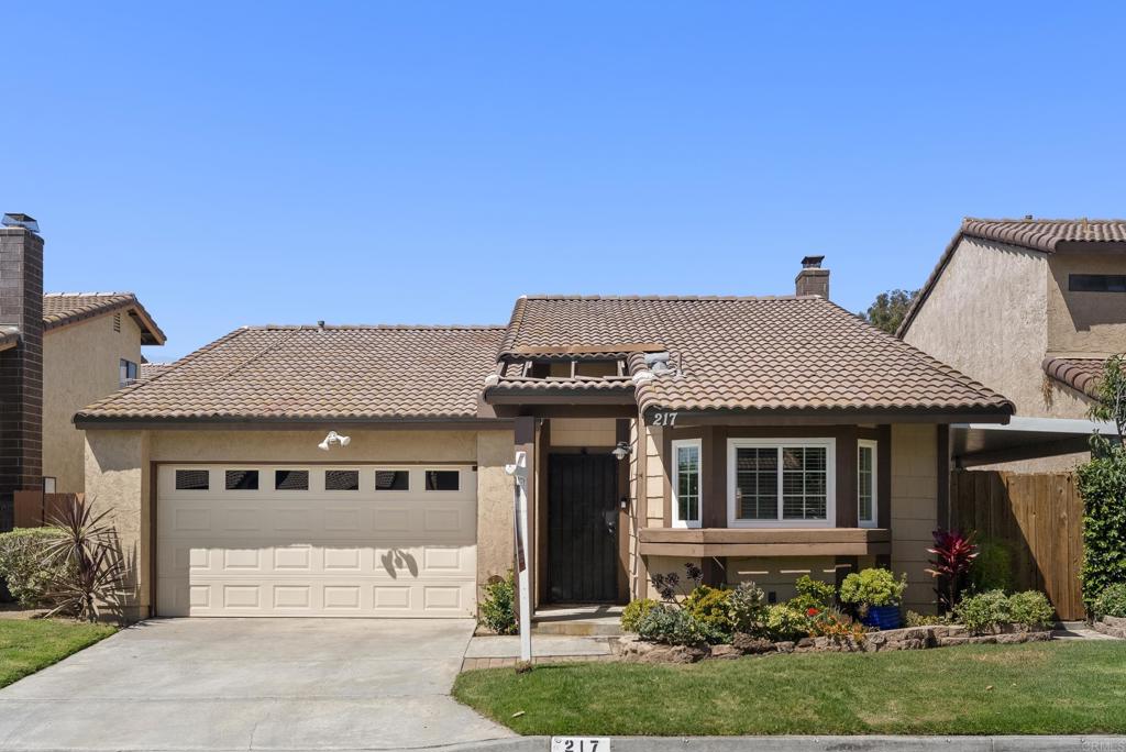 217 Levant Way Oceanside, CA 92057 - Photo 1 of 1 a front view of a house with a garden