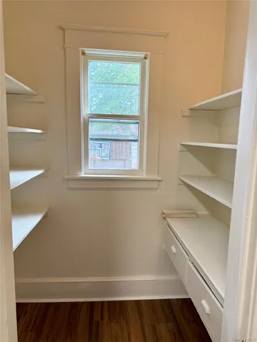 a view of an empty walk in closet