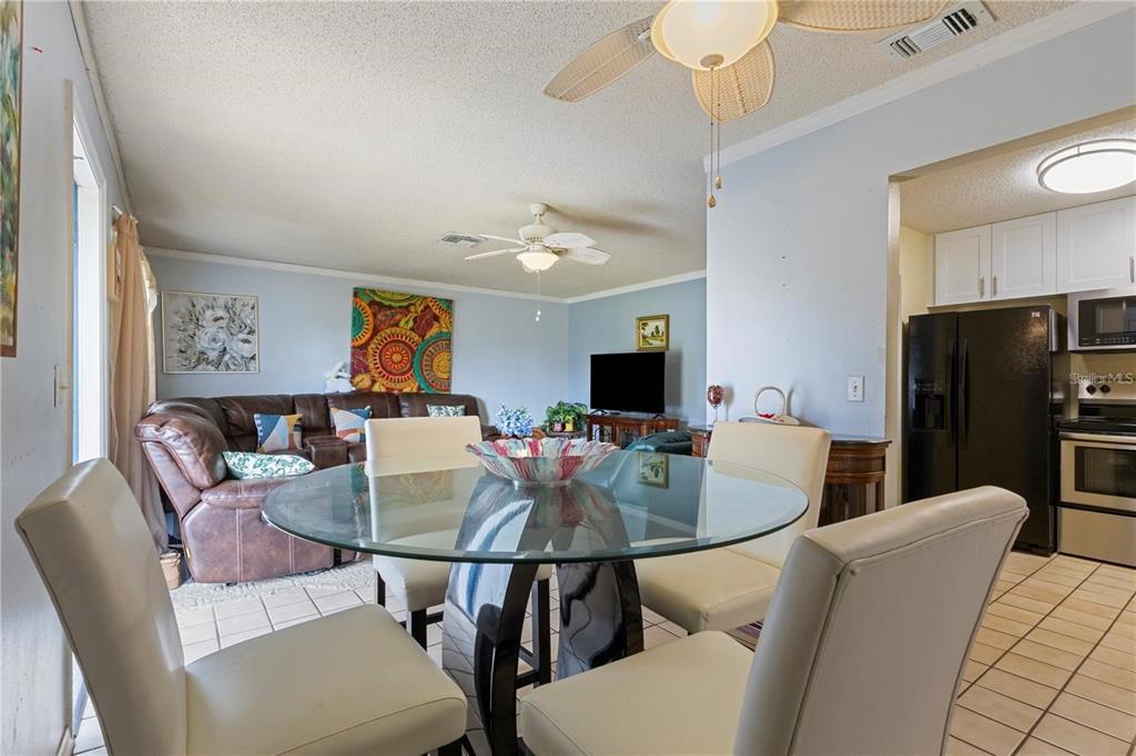 409 Feltham Trail, Unit B Sun City Center, FL 33573 - Photo 11 of 34 a view of a dining room with furniture