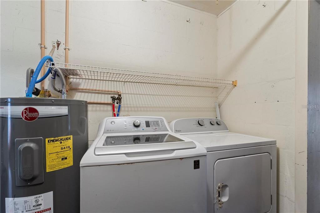 409 Feltham Trail, Unit B Sun City Center, FL 33573 - Photo 14 of 34 a utility room with dryer and washer