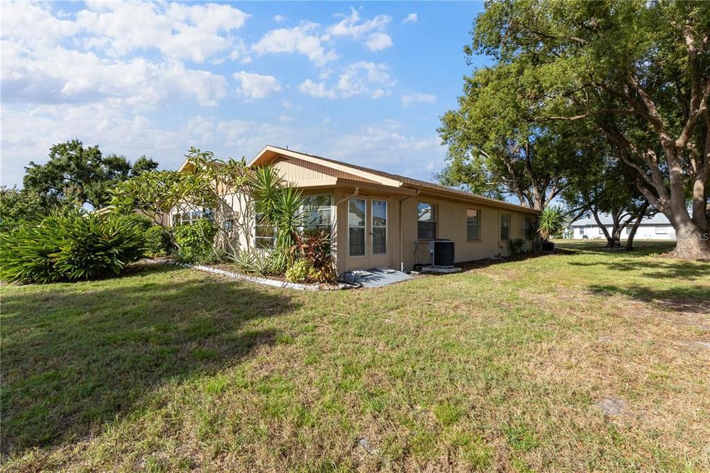 409 Feltham Trail, Unit B Sun City Center, FL 33573 - Photo 21 of 34 a front view of house with yard and green space