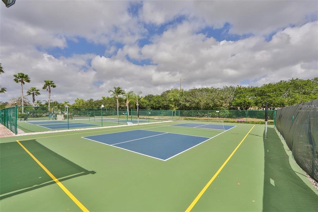 409 Feltham Trail, Unit B Sun City Center, FL 33573 - Photo 26 of 34 a view of a tennis court
