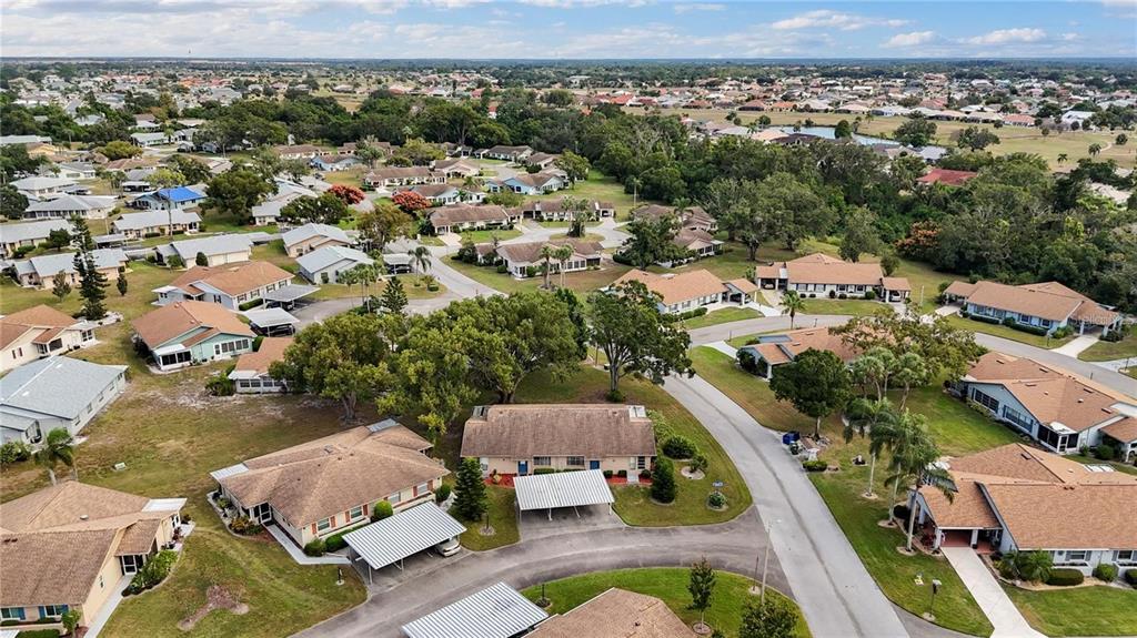 409 Feltham Trail, Unit B Sun City Center, FL 33573 - Photo 6 of 34 an aerial view of residential houses with outdoor space