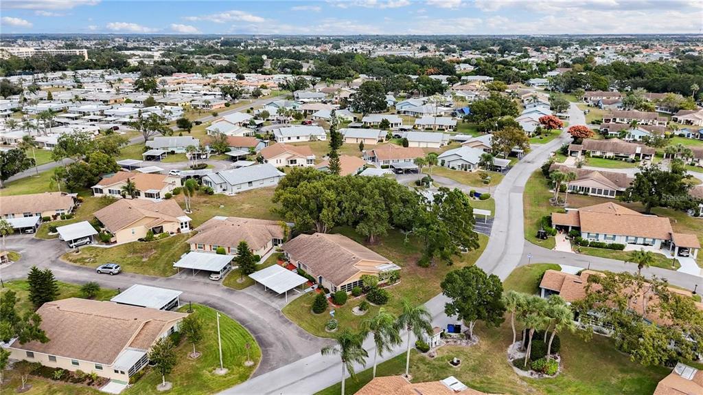 409 Feltham Trail, Unit B Sun City Center, FL 33573 - Photo 7 of 34 an aerial view of residential houses with outdoor space