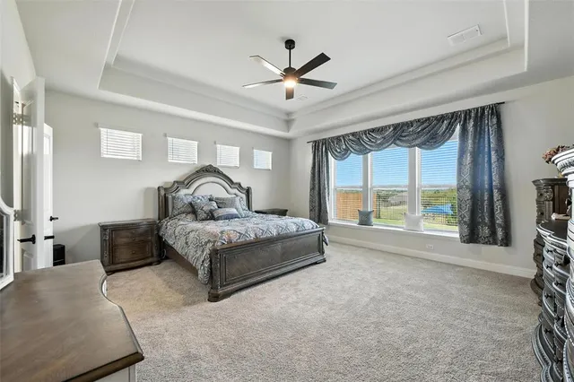 a living room with a large bed and a large window