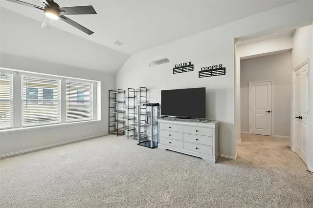 a living room with furniture and flat screen tv