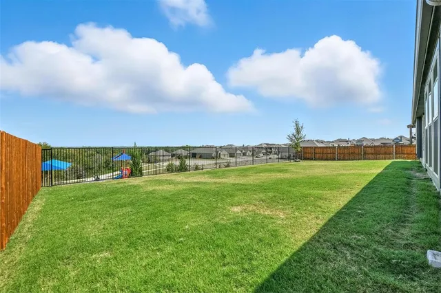 a view of a golf course with an trees