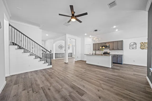 a view of kitchen with cabinets and wooden floor