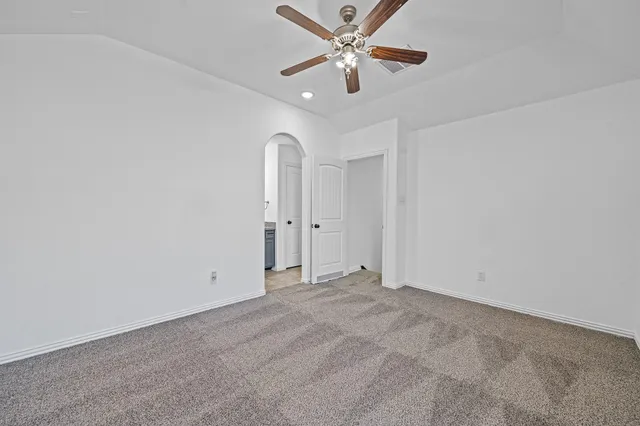 a bathroom with a granite countertop sink and mirror