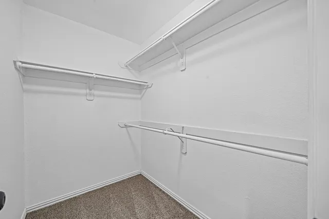 a bathroom with a toilet and a bath tub