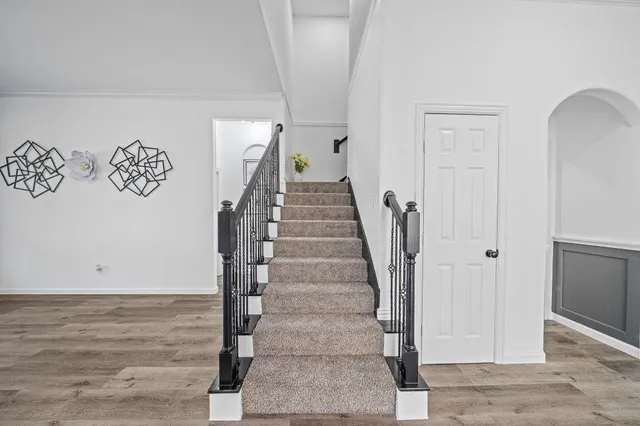 a view of a house with a yard and sitting area