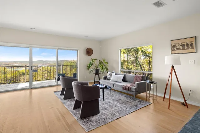 a living room with furniture and a large window