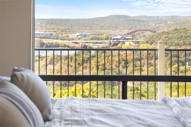 a bed room with a bed and a chair