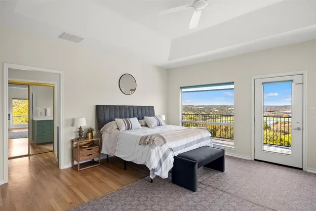 a large bathroom with a tub sink shower and mirror