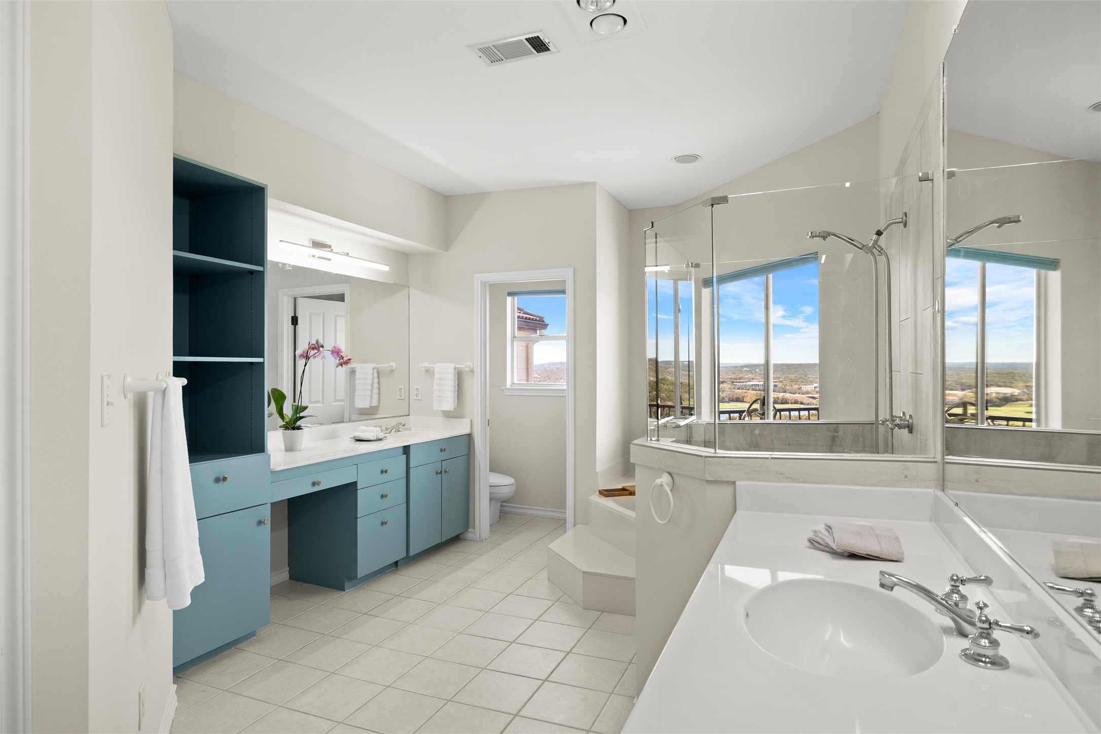 5926 Northwest Place Austin, TX 78731 - Photo 34 of 40 a spacious bathroom with a tub sink and mirror
