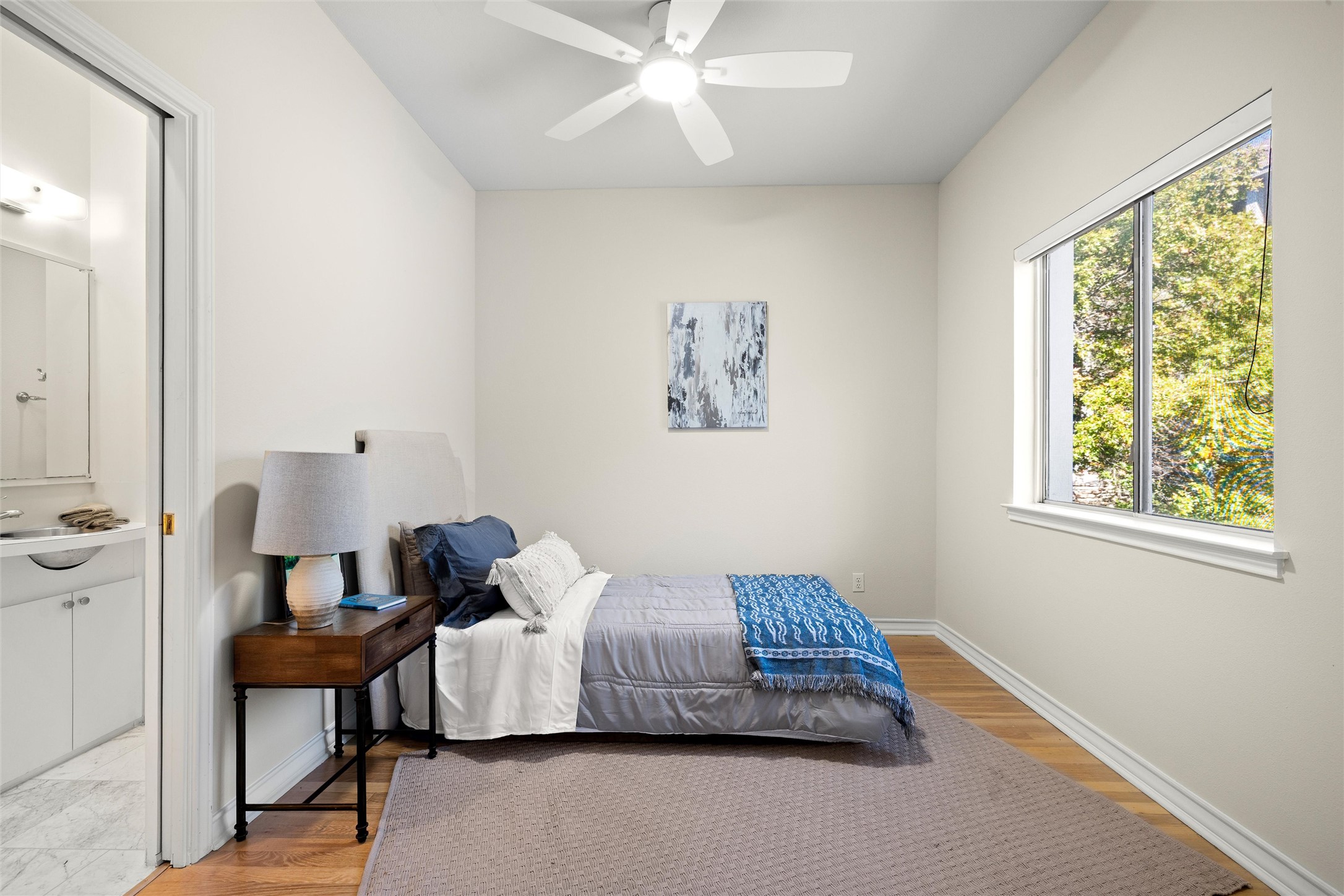 5926 Northwest Place Austin, TX 78731 - Photo 36 of 40 a bedroom with a bed and a window