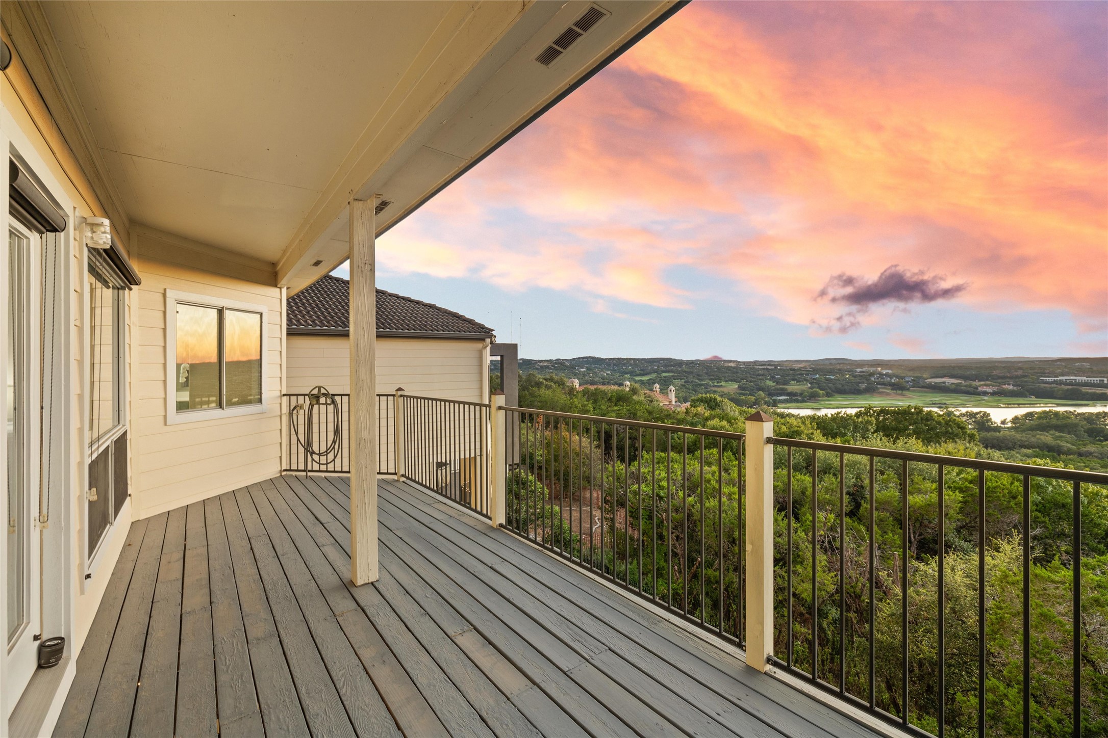 5926 Northwest Place Austin, TX 78731 - Photo 4 of 40 a view of a balcony with lake view and mountain view