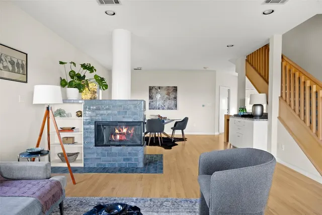 a yellow house with trees in front of it