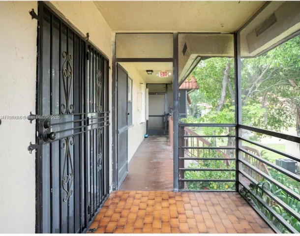 a view of a porch with wooden floor and outdoor space
