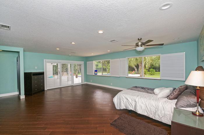 13387 Barwick Road Delray Beach, FL 33445 - Photo 14 of 28 a living room with a bed furniture and a window