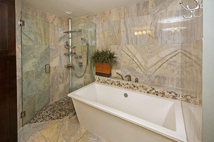13387 Barwick Road Delray Beach, FL 33445 - Photo 15 of 28 a bathroom with a bathtub and shower