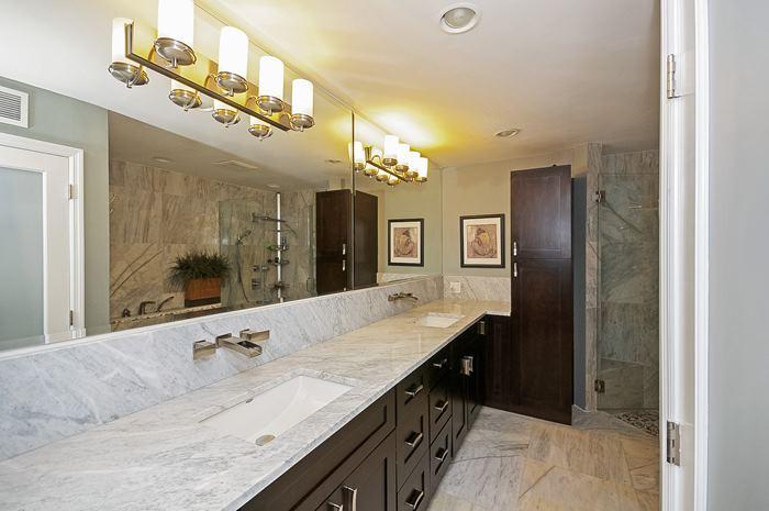13387 Barwick Road Delray Beach, FL 33445 - Photo 16 of 28 a bathroom with a granite countertop sink mirror and shower