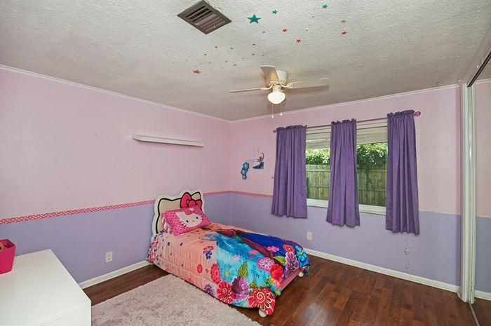 13387 Barwick Road Delray Beach, FL 33445 - Photo 18 of 28 a bedroom with furniture and a wooden floor