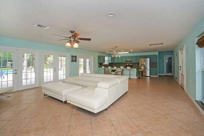 13387 Barwick Road Delray Beach, FL 33445 - Photo 2 of 28 a living room with furniture and a large window