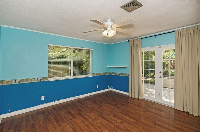 13387 Barwick Road Delray Beach, FL 33445 - Photo 22 of 28 a view of empty room with wooden floor and fan
