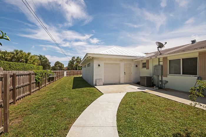 13387 Barwick Road Delray Beach, FL 33445 - Photo 26 of 28 a view of a house with backyard