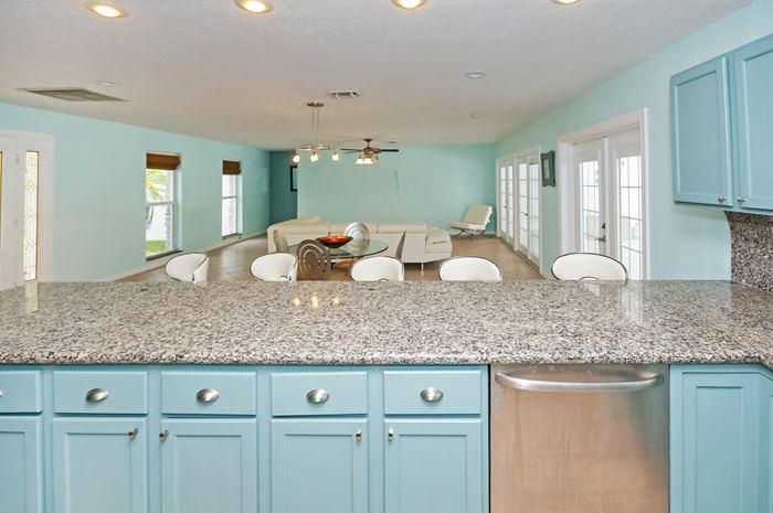 13387 Barwick Road Delray Beach, FL 33445 - Photo 5 of 28 a kitchen with white cabinets and sink