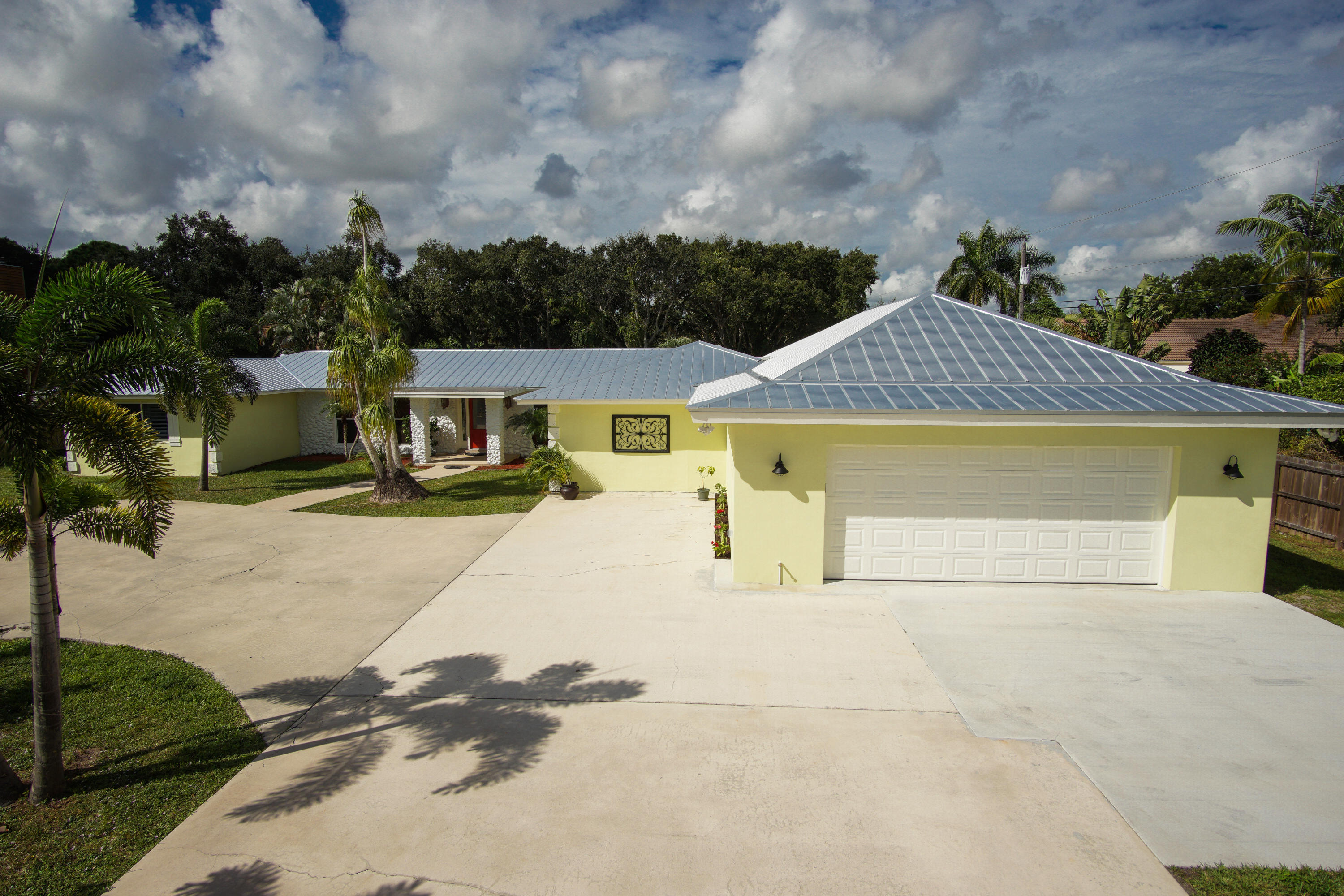 13387 Barwick Road Delray Beach, FL 33445 - Photo 9 of 28 a view of the house with a yard