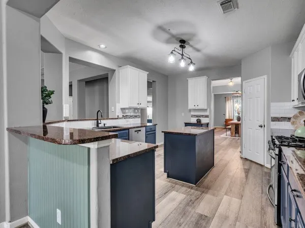 a dining room with furniture and wooden floor