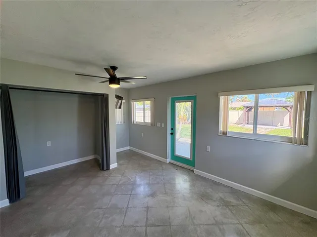 a view of an empty room with a window
