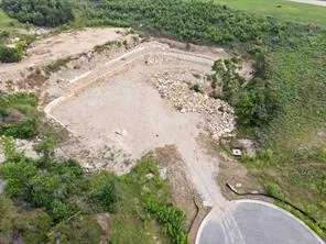 a view of a swimming pool with an outdoor seating