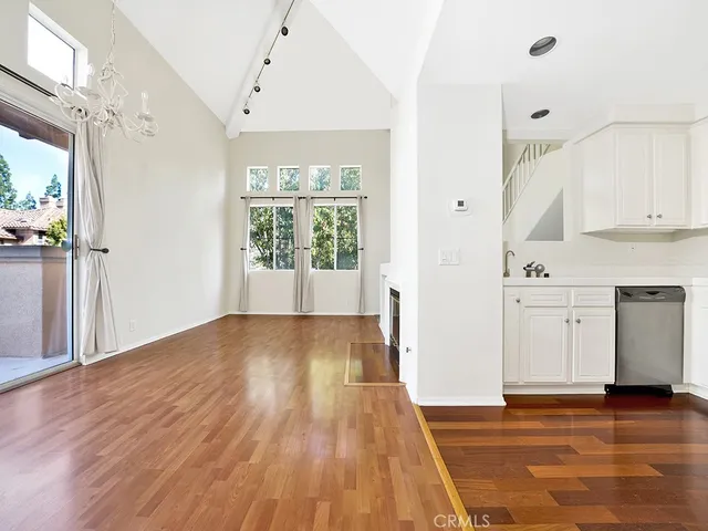 a view of a pathway of a house with wooden fence