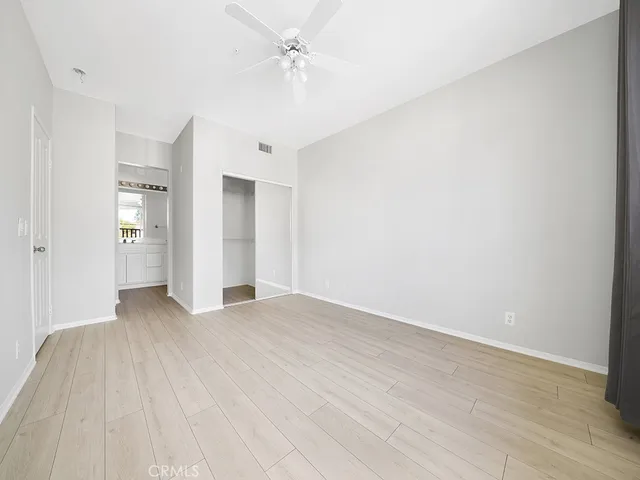 a spacious bathroom with a double vanity sink a mirror and a bathtub