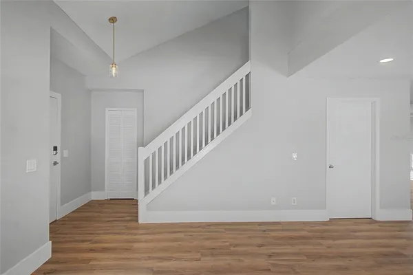 a view of entryway with wooden floor