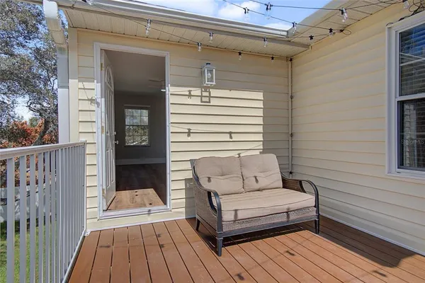 a view of a two chairs in the balcony