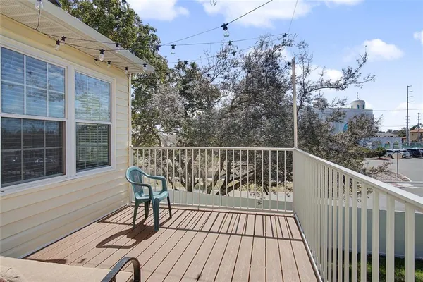 a view of a two chairs and table in the balcony