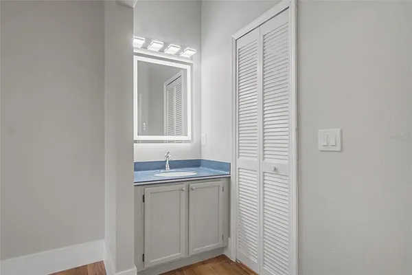 a bathroom with a sink and a mirror