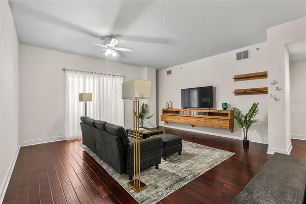 a view of a dining room with furniture and wooden floor