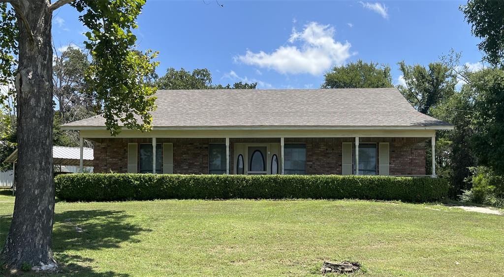front view of a house with a yard