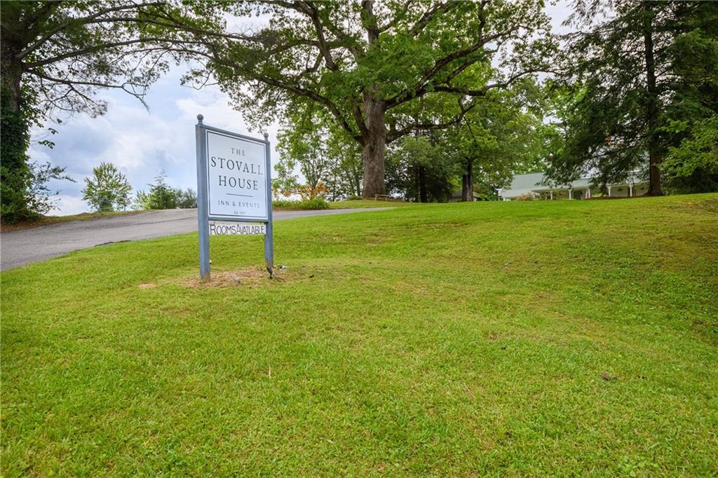 1526 Highway 255 Sautee Nacoochee, GA 30571 - Photo 16 of 61 a sign board with grassy field