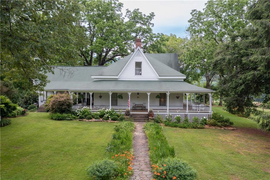 1526 Highway 255 Sautee Nacoochee, GA 30571 - Photo 2 of 61 a front view of a house with a yard and potted plants