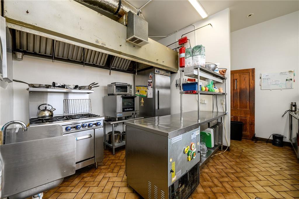 1526 Highway 255 Sautee Nacoochee, GA 30571 - Photo 29 of 61 a kitchen with stainless steel appliances granite countertop a stove and a refrigerator