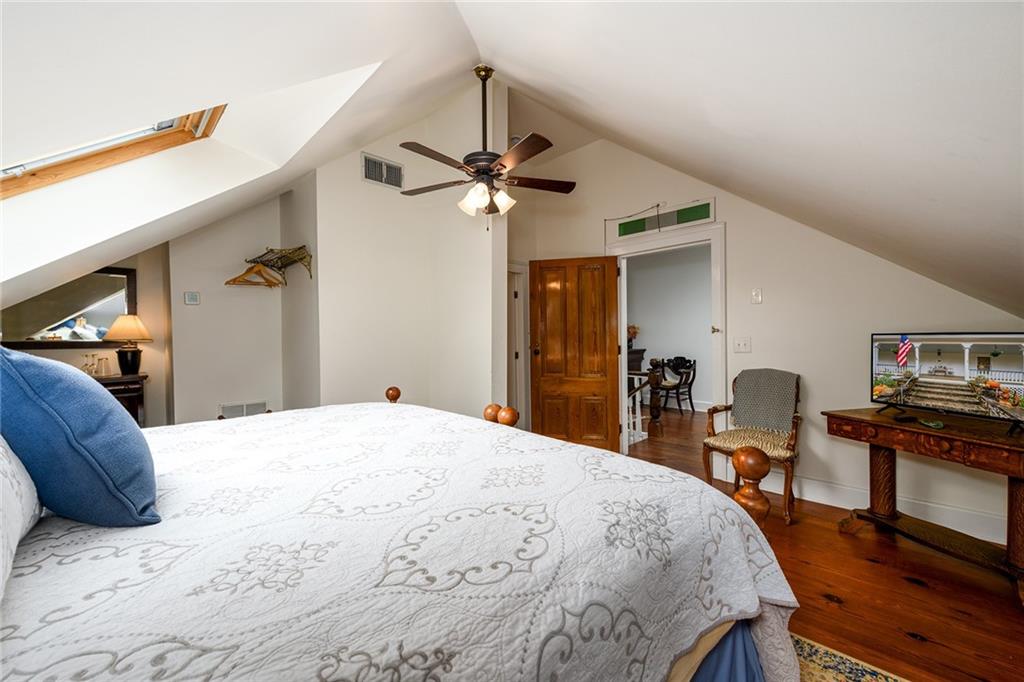 1526 Highway 255 Sautee Nacoochee, GA 30571 - Photo 44 of 61 a bedroom with a bed and a chandelier