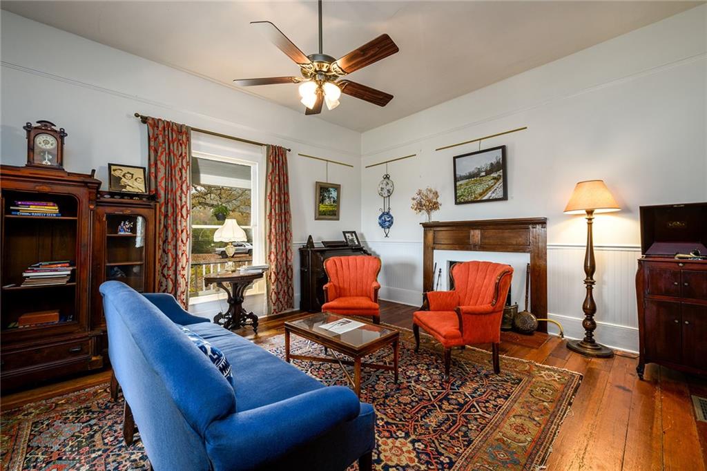 1526 Highway 255 Sautee Nacoochee, GA 30571 - Photo 6 of 61 a living room with furniture a fireplace and a flat screen tv